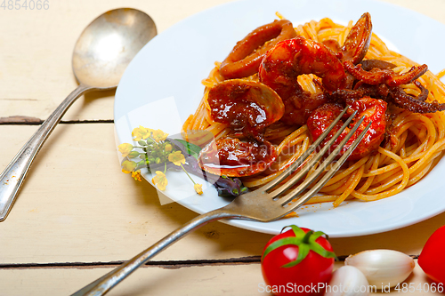 Image of Italian seafood spaghetti pasta on red tomato sauce