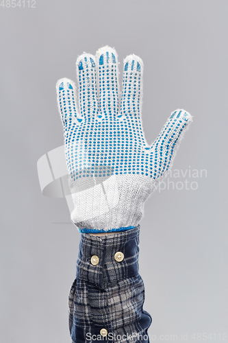 Image of builder's hand in protective glove