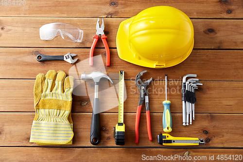 Image of different work tools on wooden boards