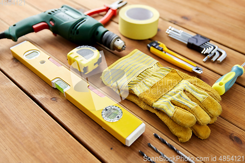 Image of different work tools on wooden boards