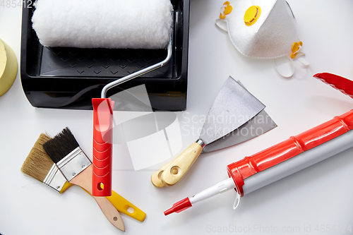 Image of different painting work tools on white background