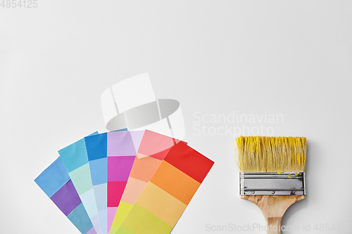 Image of paint brush and color palette on white background