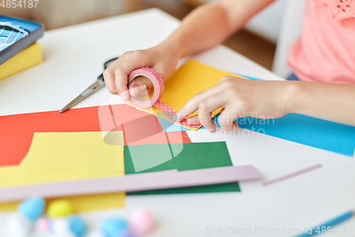 Image of creative girl making greeting card at home