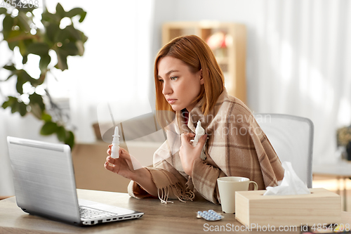 Image of sick woman having video call on laptop at home