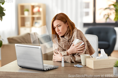 Image of sick woman having video call on tablet pc at home