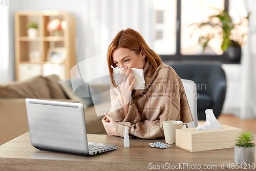 Image of sick woman having video call on tablet pc at home