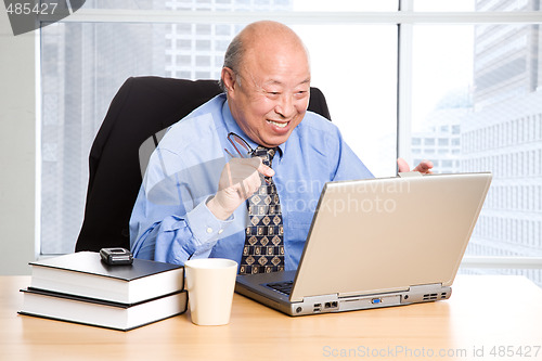 Image of Senior asian businessman