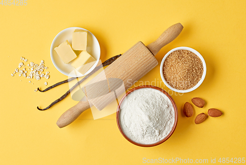 Image of baking ingredients on yellow background