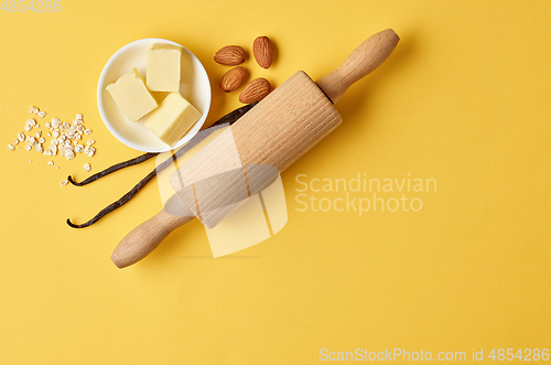Image of baking ingredients on yellow background