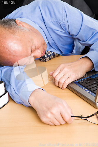 Image of Senior asian businessman sleeping