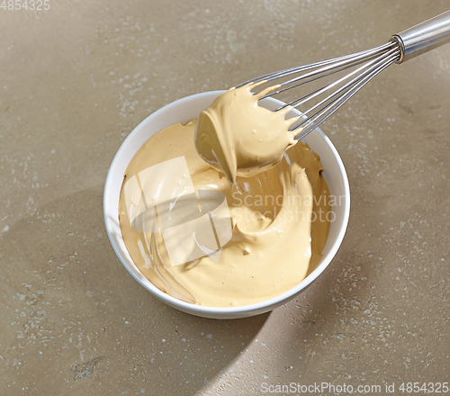 Image of bowl of whipped instant coffee with sugar and water