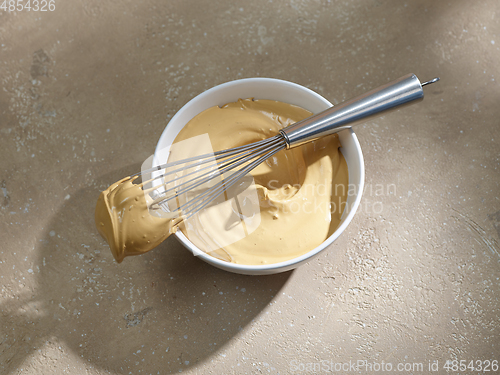 Image of bowl of whipped instant coffee with sugar and water