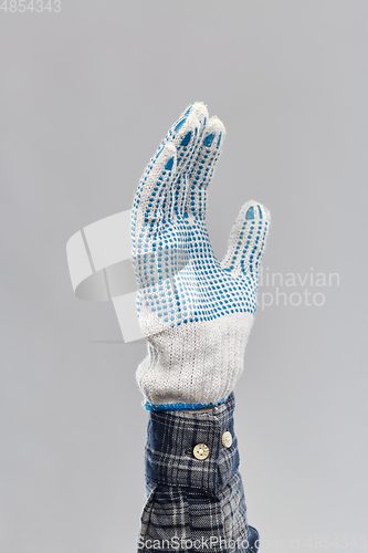 Image of builder's hand in protective glove