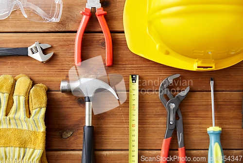 Image of different work tools on wooden boards