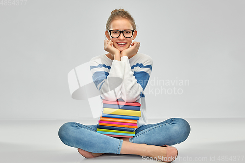 Image of happy smiling teenage student girl with books