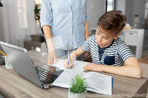 Image of mother and son doing homework together