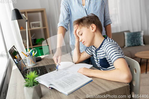 Image of mother and son doing homework together