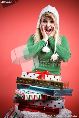 Image of Surprised caucasian girl with gifts