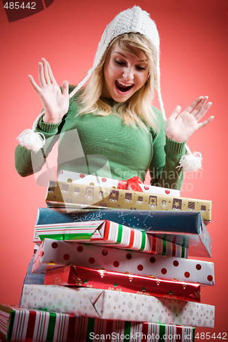 Image of Caucasian girl receiving christmas gifts