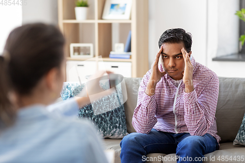 Image of man and psychologist at psychotherapy session