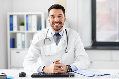 Image of happy male doctor with stethoscope at hospital