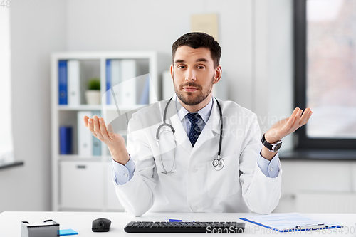 Image of male doctor having video conference at hospital