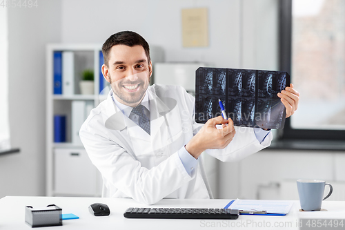 Image of doctor with x-ray having video call at clinic