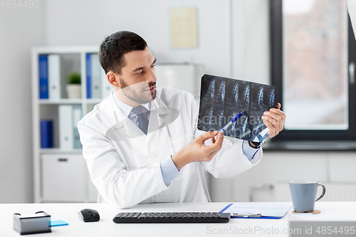 Image of doctor with x-ray having video call at clinic