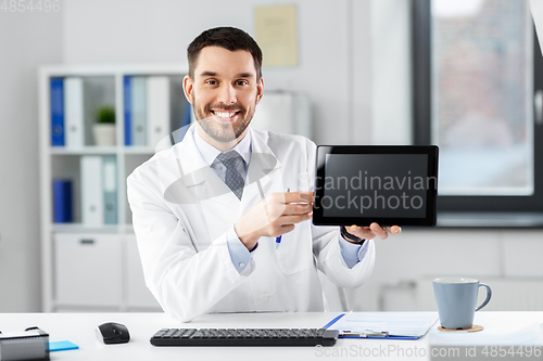 Image of doctor with tablet pc having video call at clinic