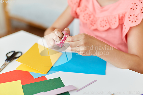 Image of creative girl making greeting card at home