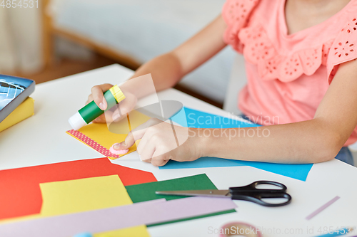 Image of creative girl making greeting card at home