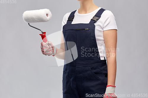 Image of close up of painter or builder with paint roller