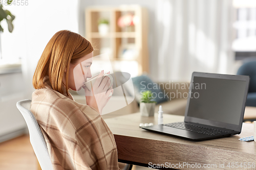 Image of sick woman having video call on laptop at home