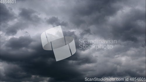 Image of Time lapse Nature background Ominous clouds drift slowly across the sky, threatening rain. UltraHD stock footage