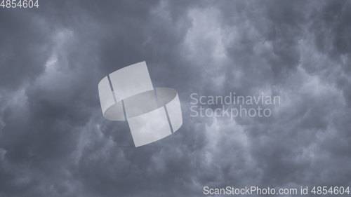 Image of Time lapse Nature background Ominous clouds drift slowly across the sky, threatening rain. UltraHD stock footage