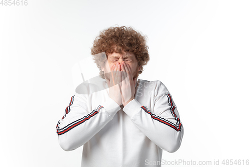 Image of How coronavirus changed our lives. Young man coughing on white background