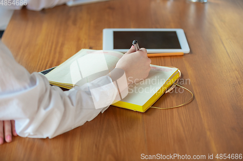 Image of Young caucasian business woman working in office, diversity and girl power concept, close up