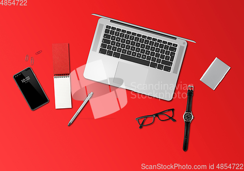 Image of Office desk mockup top view isolated on red