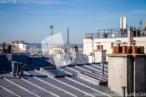 Image of The traditional roofs of paris and the eiffel tower