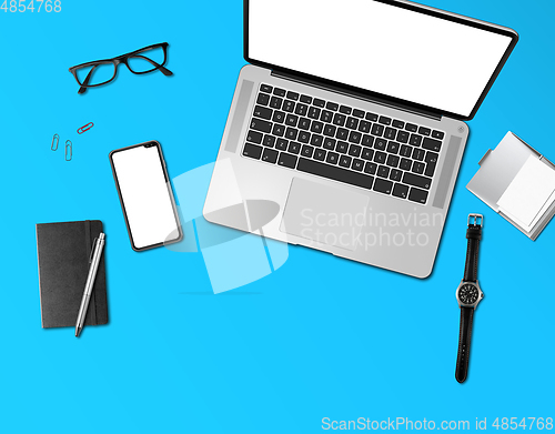 Image of Office desk mockup top view isolated on blue