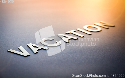 Image of Word vacation written with white solid letters