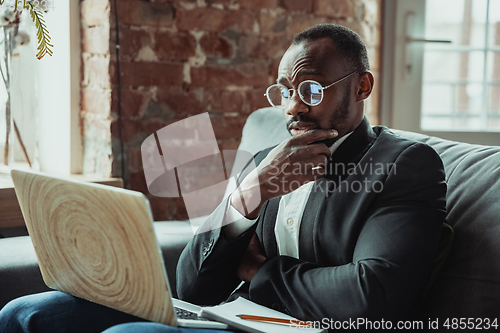 Image of Businessman or student working from home while being isolated or keep quarantine \'cause of coronavirus COVID-19