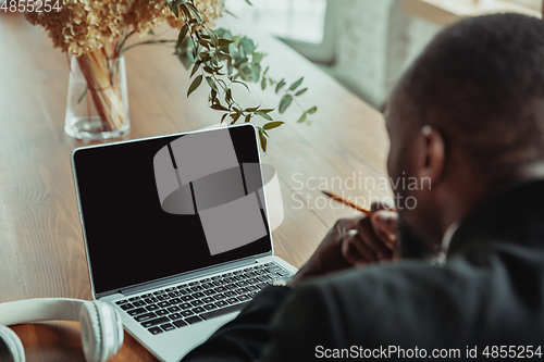 Image of Businessman or student working from home while being isolated or keep quarantine \'cause of coronavirus COVID-19