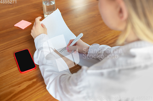 Image of Young caucasian business woman working in office, diversity and girl power concept, close up