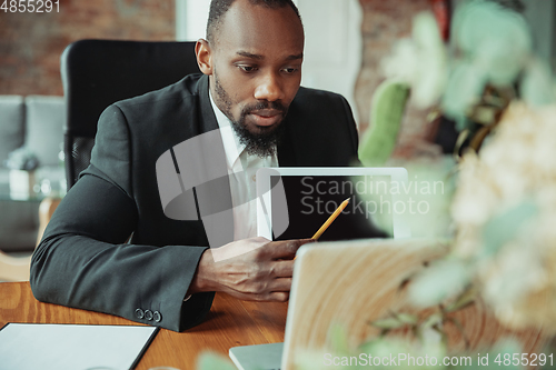 Image of Businessman or student working from home while being isolated or keep quarantine \'cause of coronavirus COVID-19