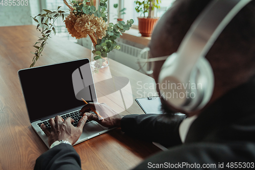 Image of Businessman or student working from home while being isolated or keep quarantine \'cause of coronavirus COVID-19