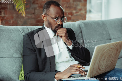 Image of Businessman or student working from home while being isolated or keep quarantine \'cause of coronavirus COVID-19