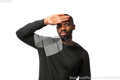 Image of How coronavirus changed our lives. Young man taking temperature on white background