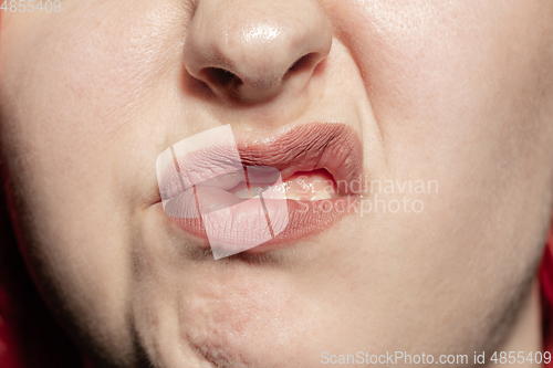 Image of Close-up female mouth with natural lips make-up. Cosmetology, dentistry and beauty care, human emotions