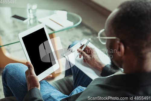 Image of Businessman or student working from home while being isolated or keep quarantine \'cause of coronavirus COVID-19